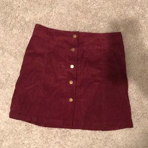 Size medium maroon button up skirt.